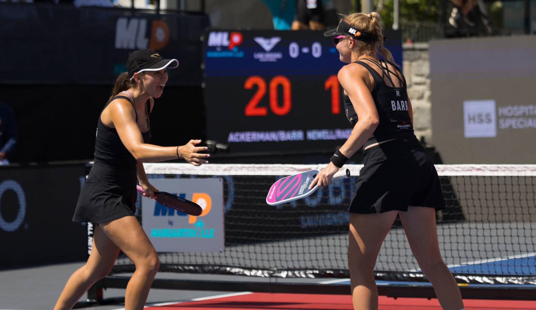 Photo of Emily and Susannah cheering each other on